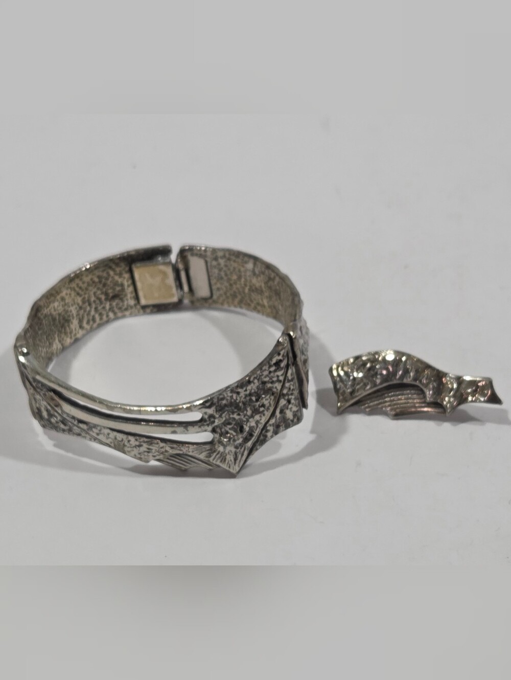 Jean Claude Darveau Silver Plate Hammered Bracelet and Single Earring.